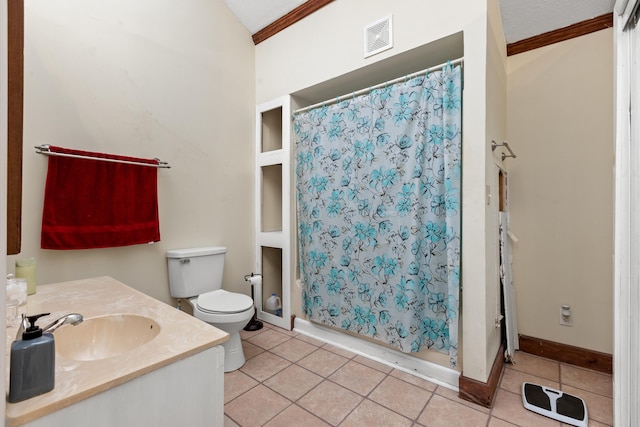 bathroom featuring a textured ceiling, toilet, ornamental molding, tile patterned flooring, and vanity