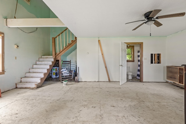 unfurnished living room featuring ceiling fan