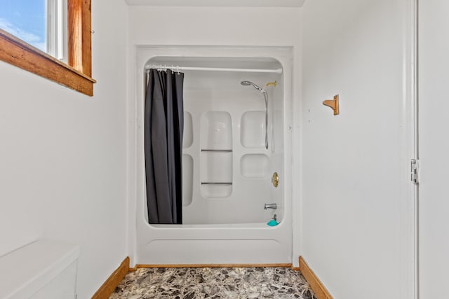 bathroom with shower / bathtub combination with curtain