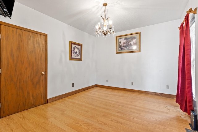 interior space featuring a notable chandelier and light hardwood / wood-style floors