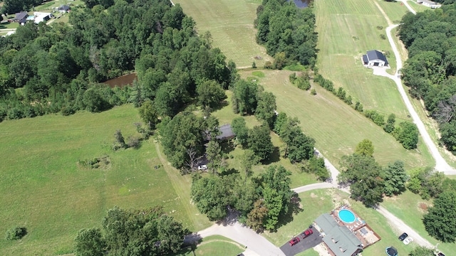 birds eye view of property with a rural view