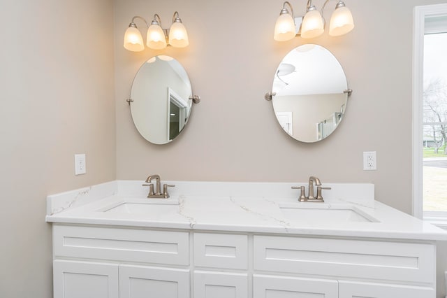 bathroom featuring dual bowl vanity