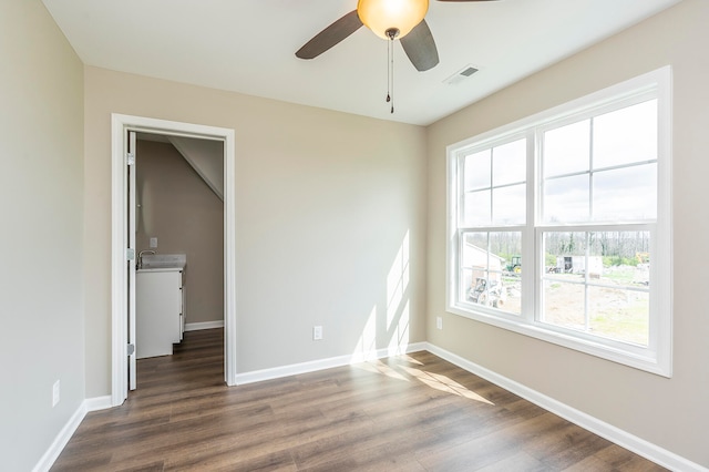 unfurnished bedroom with ceiling fan and hardwood / wood-style floors