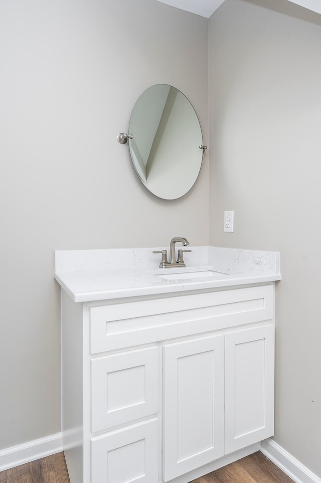 bathroom featuring vanity and wood-type flooring