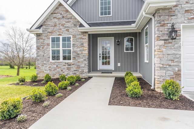 doorway to property featuring a garage