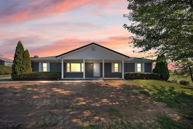 ranch-style house featuring a yard