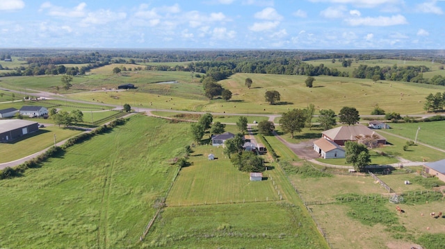 birds eye view of property with a rural view