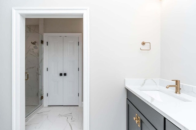 bathroom with vanity, walk in shower, and tile patterned flooring