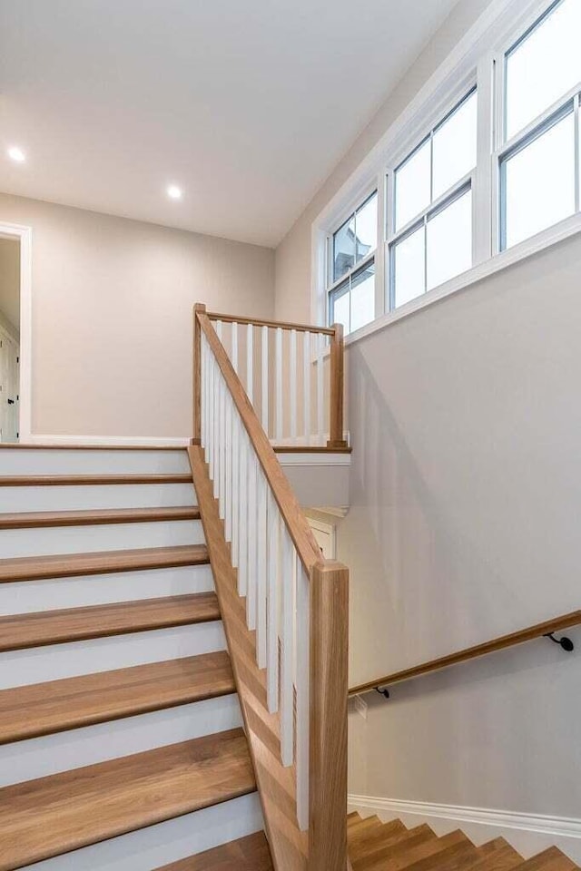 stairs featuring wood-type flooring