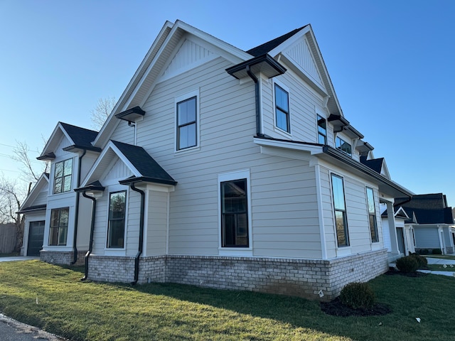 view of property exterior featuring a lawn