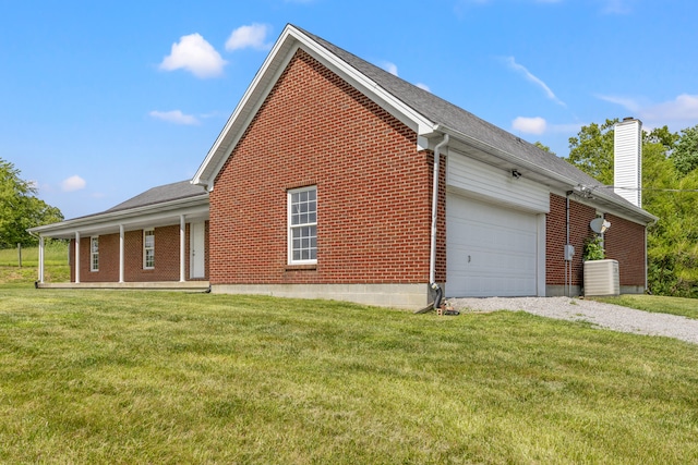 view of property exterior featuring central air condition unit, a yard, and a garage