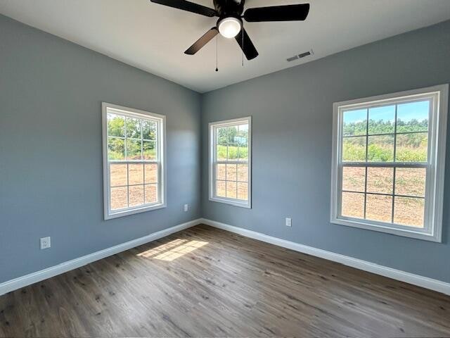 spare room featuring ceiling fan and wood-type flooring