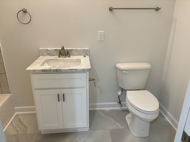 bathroom featuring vanity, toilet, tile patterned floors, and a bath