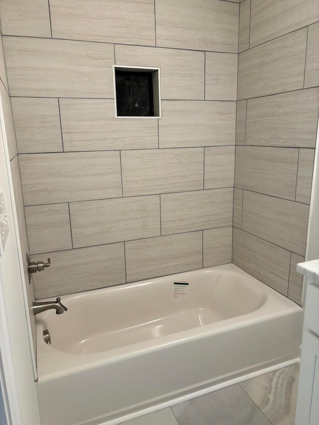 bathroom featuring vanity and a tub to relax in