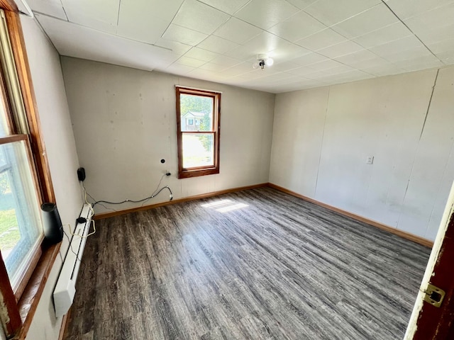 spare room with hardwood / wood-style flooring