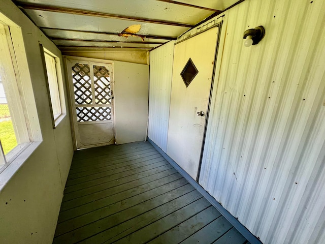 interior space with wood-type flooring and vaulted ceiling