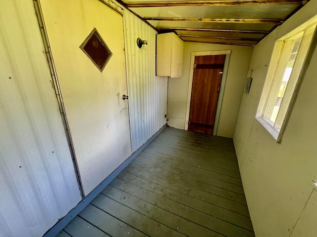 interior space featuring lofted ceiling and hardwood / wood-style flooring