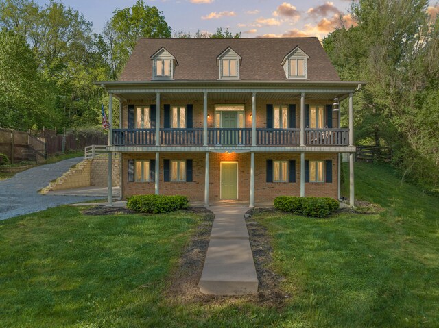 view of front of house with a yard