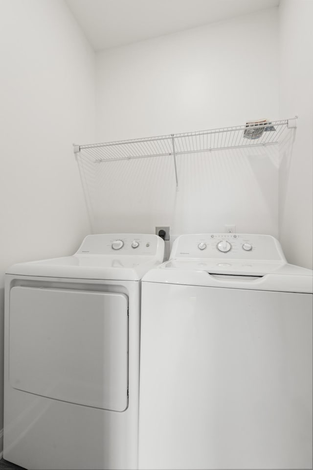 laundry room featuring washing machine and dryer