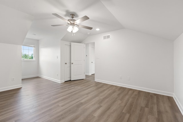 bonus room with hardwood / wood-style floors, ceiling fan, and lofted ceiling