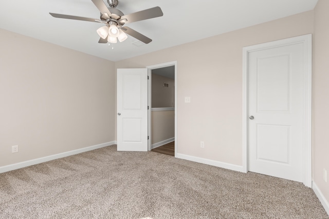 unfurnished bedroom featuring carpet floors and ceiling fan