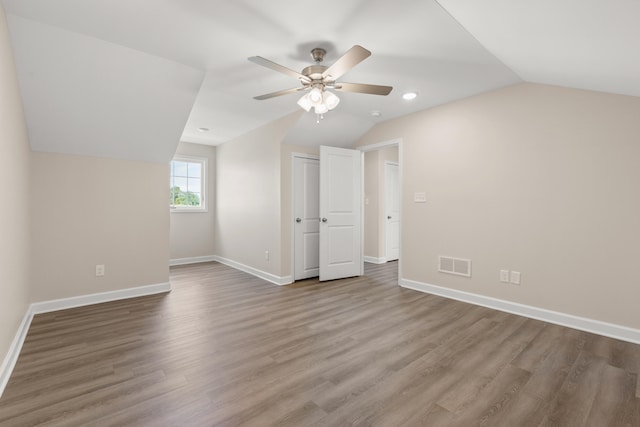 bonus room featuring ceiling fan, hardwood / wood-style flooring, and lofted ceiling