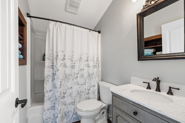 full bathroom featuring toilet, vanity, and shower / tub combo