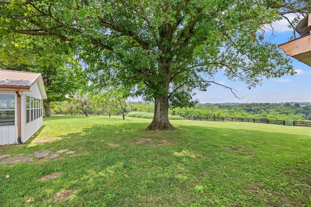 view of yard with a rural view