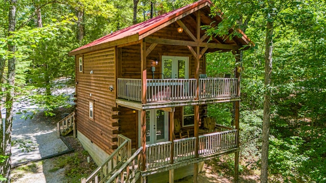 back of property featuring french doors