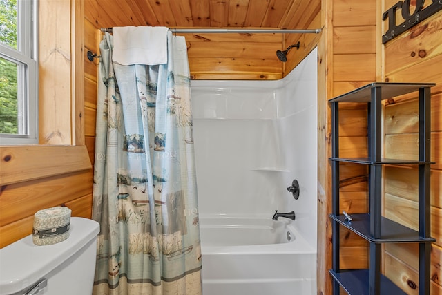 bathroom with wood walls, toilet, wooden ceiling, and shower / tub combo with curtain