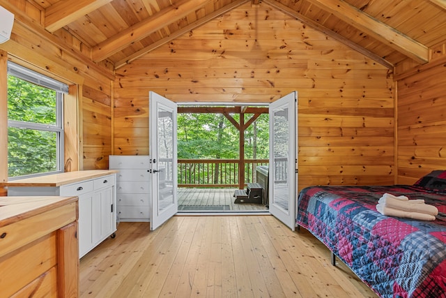 bedroom featuring light hardwood / wood-style floors, wooden ceiling, and vaulted ceiling with beams