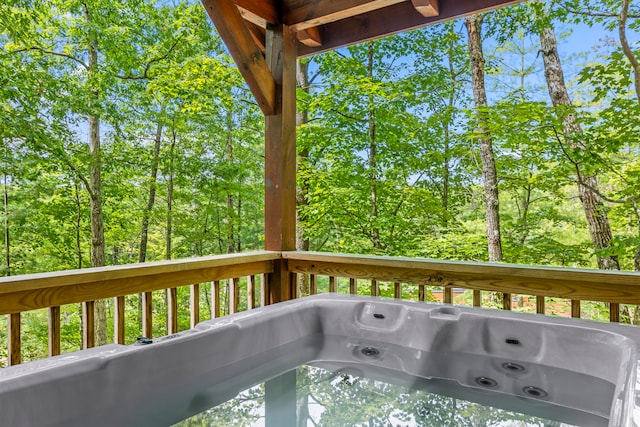 deck featuring a hot tub