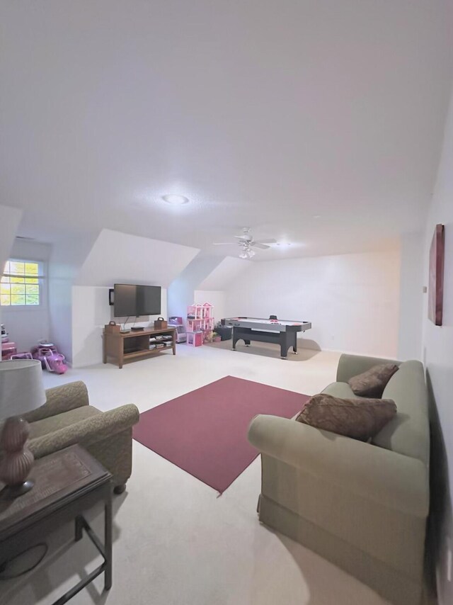 carpeted living room with billiards and ceiling fan