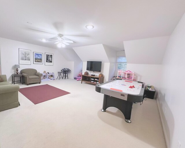 rec room with ceiling fan, carpet floors, and lofted ceiling