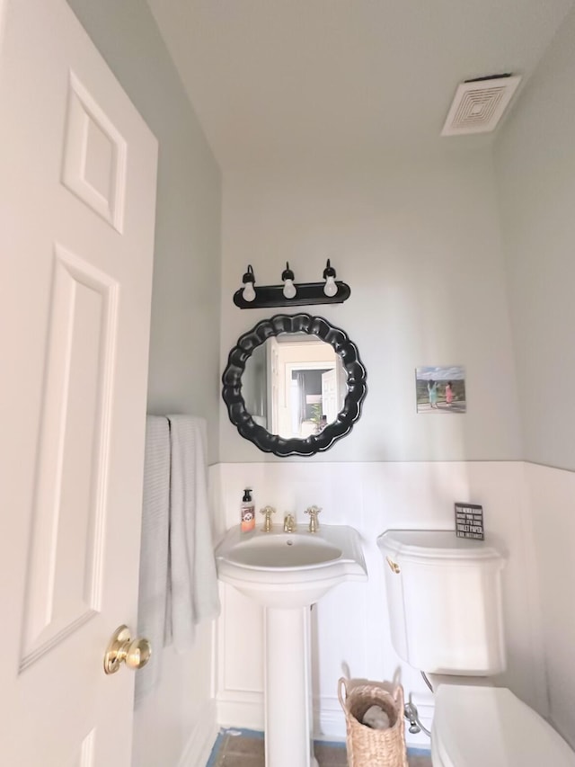 bathroom featuring sink and toilet