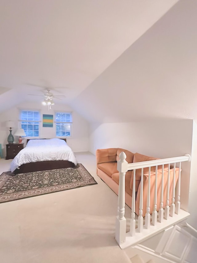 bedroom featuring carpet flooring, ceiling fan, and vaulted ceiling