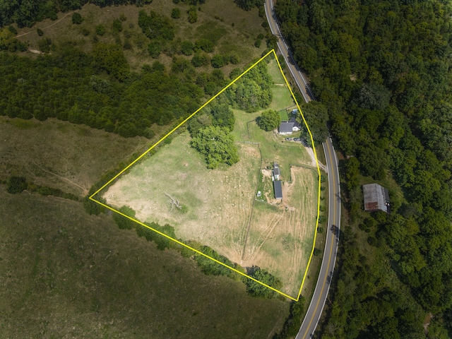 birds eye view of property with a rural view