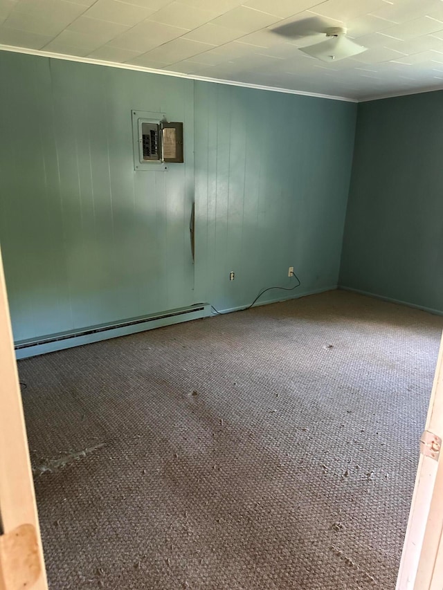 unfurnished room featuring baseboard heating, ornamental molding, an AC wall unit, and carpet flooring