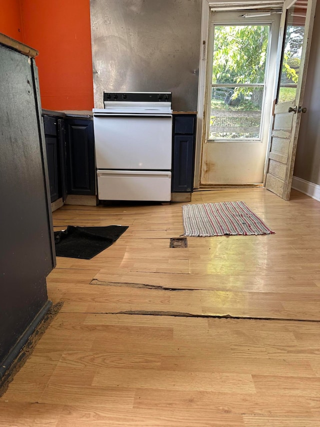 kitchen featuring light wood-type flooring and electric stove