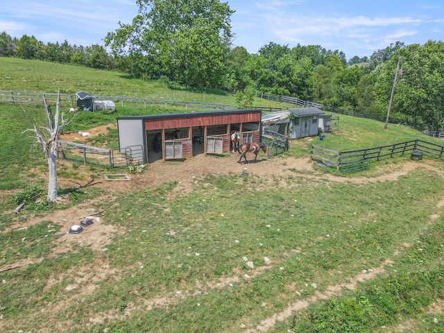 exterior space with an outbuilding and a rural view