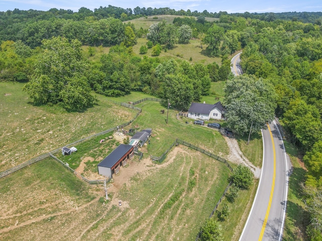 birds eye view of property with a rural view