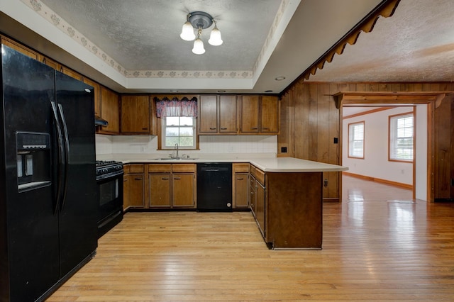 empty room featuring a textured ceiling and light hardwood / wood-style flooring