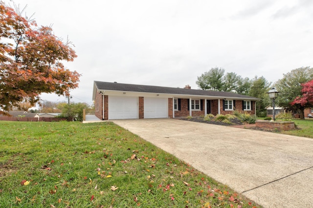 single story home with a garage and a front lawn