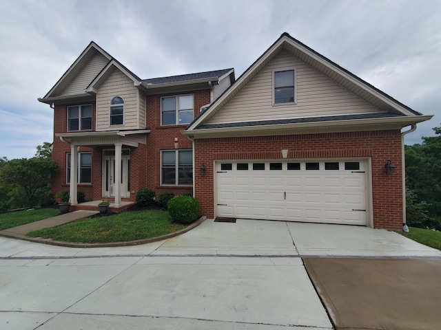 traditional-style house featuring concrete driveway, brick siding, and an attached garage