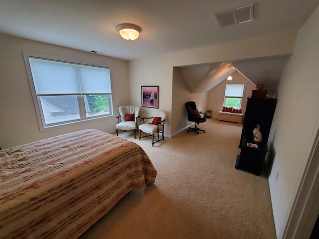 bedroom with light colored carpet, visible vents, and baseboards