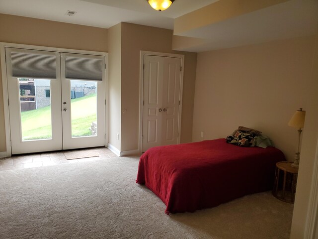 bedroom featuring baseboards, visible vents, light colored carpet, access to outside, and french doors