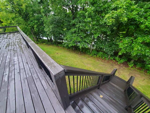 wooden terrace with a yard