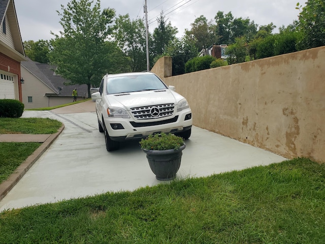 exterior space with concrete driveway