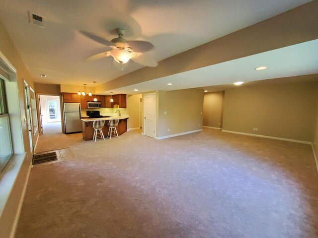 unfurnished living room featuring recessed lighting, visible vents, ceiling fan, and baseboards