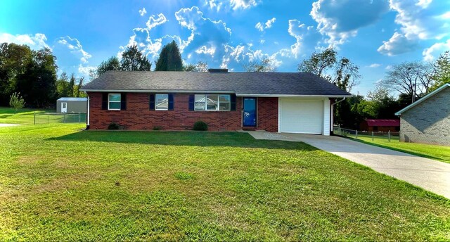 ranch-style house with a front yard and a garage